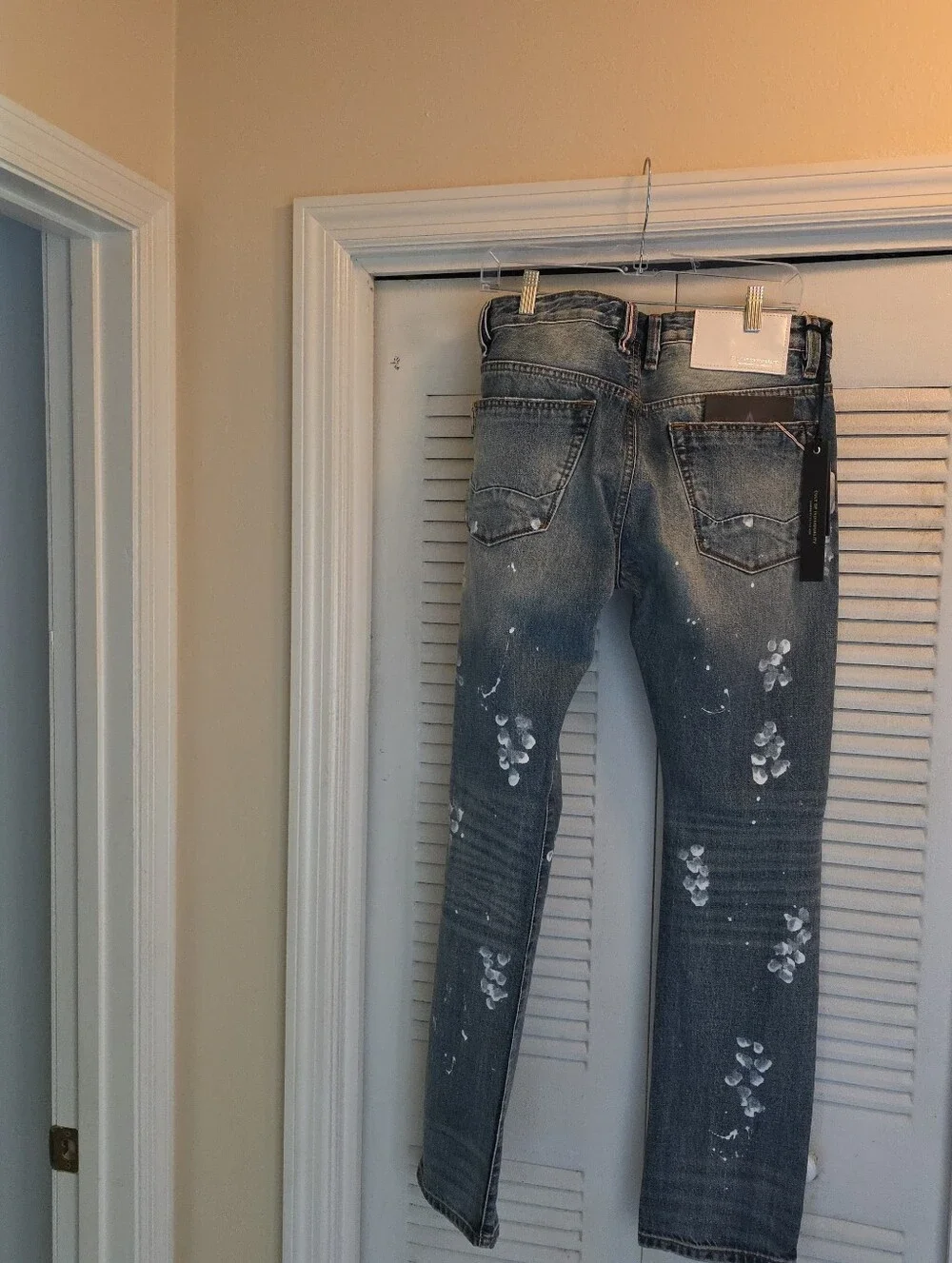 Cult of Individuality Distressed Skinny Jeans in Faded Blue with Zipper Cuffs